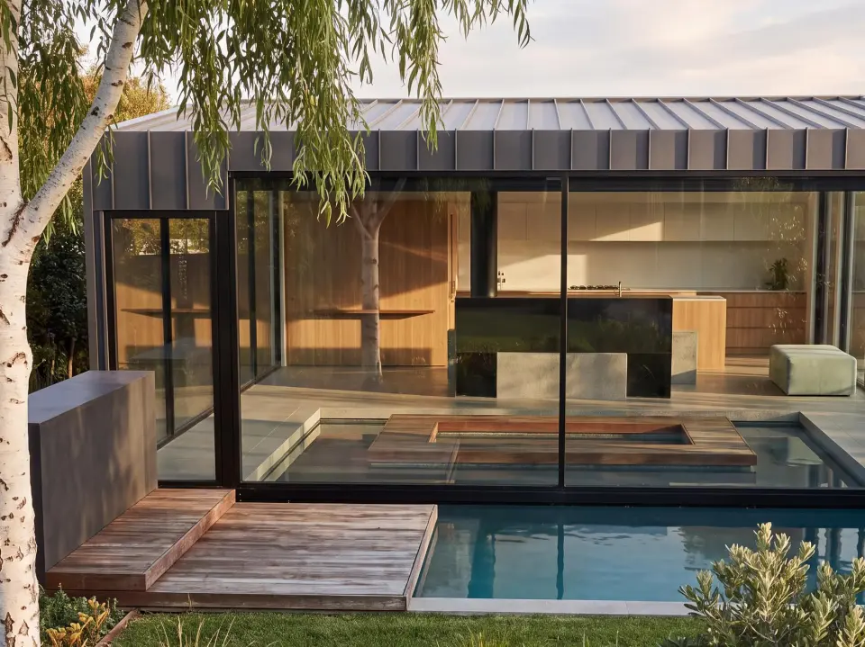 An AI-enhanced picture of Sonas I, a home Designed for PLACE: a glass pavilion beside a pool and a silver birch. AI-enhanced, indicative.
